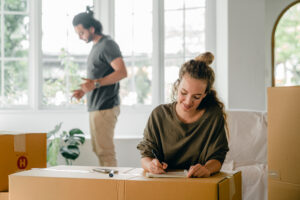 Young woman prepares to move home