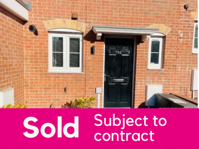 an image of the front of a house with a magenta sold banner along the bottom of the image to illustrate that the house has been sold.